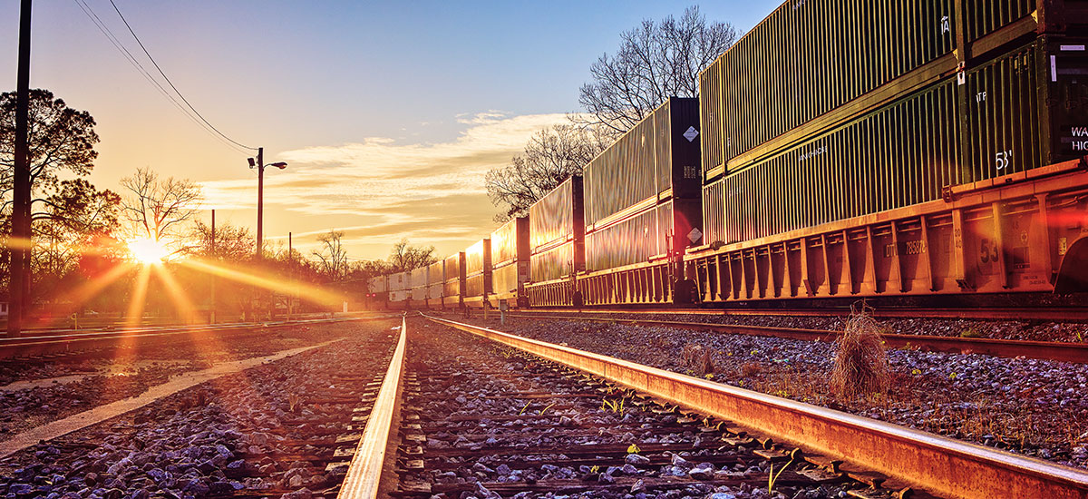 Train in motion at sunset