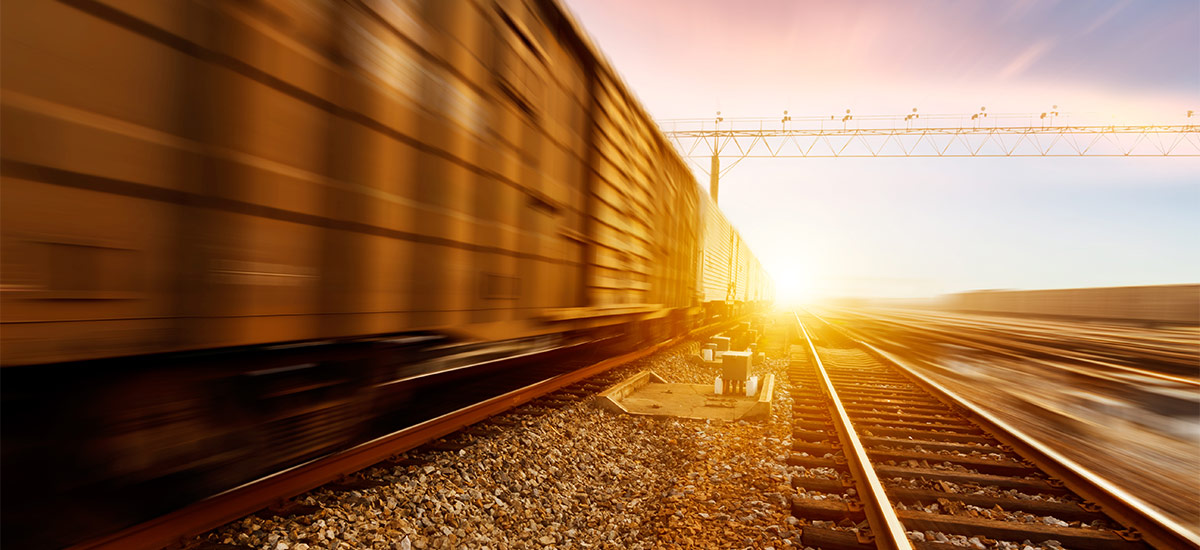 Train in motion at sunset